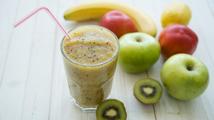 smoothies from kiwi on a wooden background