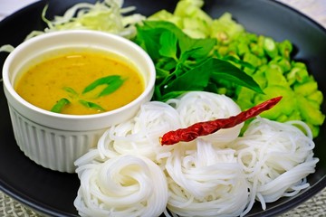 Thai rice vermicelli served with Thai local southern curry sauce and variety vegetables.