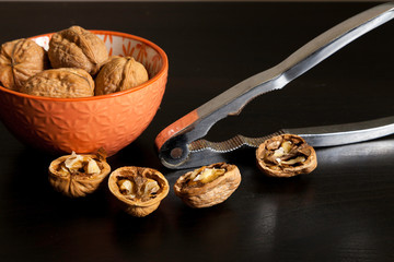 Handful of walnuts and nutcracker