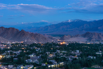 Fototapeta na wymiar Leh city at night in summer season surrounded by Himalaya mountains range in Ladakh region, Northern India