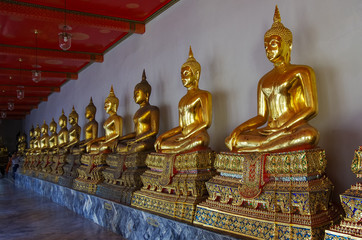 Buddha statues in Wat Pho or Wat Phra Chetuphon, Temple of the Reclining Buddha. Bangkok, Thailand