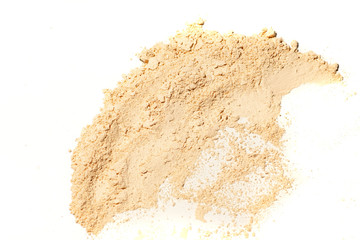 Whitening Mineral Loose Powder.Scattered tan colored facial loose powder on white background. - obrazy, fototapety, plakaty