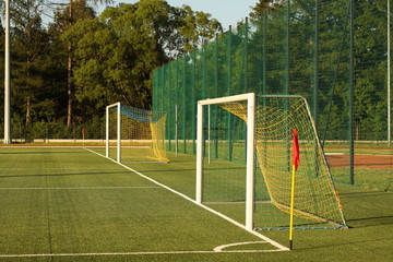 Jaslo, Poland - 7 9 2019: Goal on a football field with natural green grass in the open stadium of the city. A place for competitions and sporting events. Landscaping sports. Outdoor activities