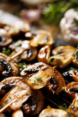 Mushroom skewers with herbs and garlic marinade  close up view 