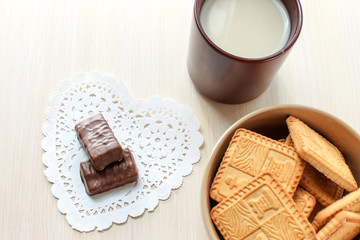 Breakfast cup cocoa with milk cookies and chocolate candy