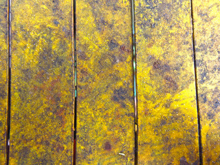 dirty yellow wood floor with peeling paint texture
