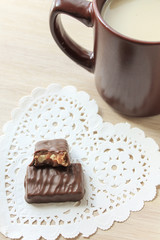Breakfast cup cocoa with milk cookies and chocolate candy