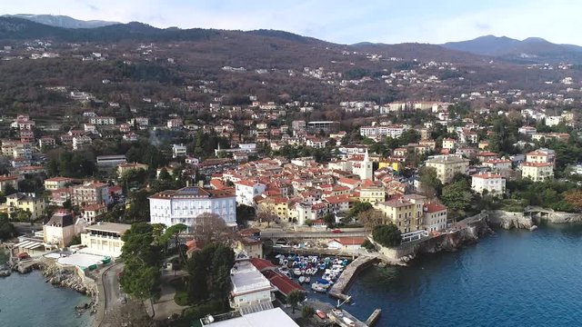 Town of Lovran and Lungomare sea walkway aerial footage, Kvarner bay of Croatia