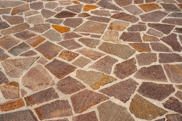Floor of carved rustic stones of various colors