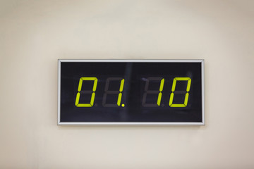 Black digital clock on a white background showing time 01:10