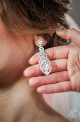 bride wearing earring on the ear