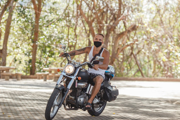 young man riding a motorcycle ,Thailand, Phuket,bike, motorcycle, bicycle, man, biker, motorbike, ride, motor, young, road, riding, rider, chopper, transportation, speed, boy, cycling, park, person, 
