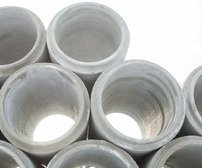 Stack of new concrete pipes.