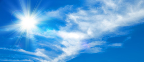 Sunny background, blue sky with white clouds and sun