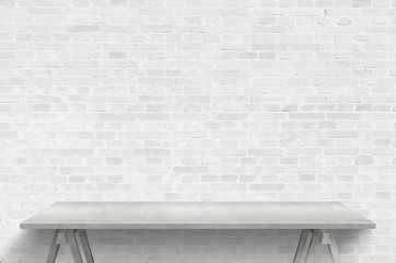 Empty gray desk and brick wall for producrt presentation. Free space for promo text