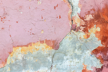 Rough pink concrete wall texture background. Old cracked plaster crumbles.