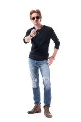Rude young adult red hair man showing middle finger obscene gesture looking at camera. Full body isolated on white background. 