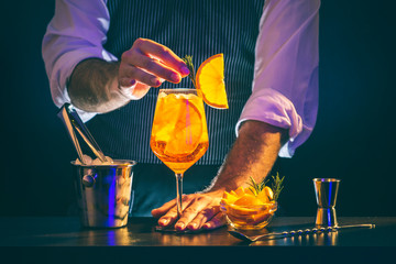 Bartender serving Aperol spritz cocktail