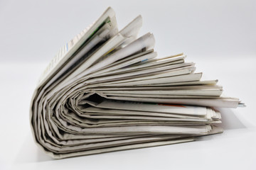 Pile of newspapers stacks on blur background
