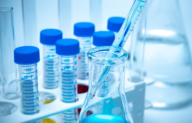 Close-up of the test tube on a blue background.