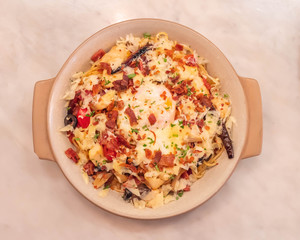 spaghetti carbonara with fried becon and egg
