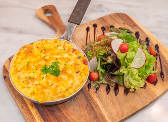 baked potatoes with cream and cheese with salad on Chopping Wood