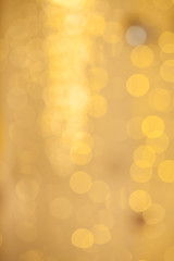Bokeh Christmas background. Golden glitter sparkle defocused background
