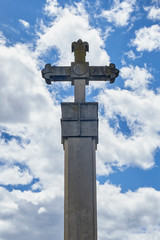 stone cross over cloudy sky
