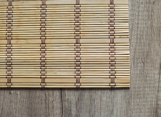Bamboo mat on the wood table napkin on a wooden board home decor and comfort