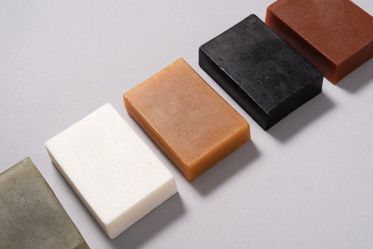 Set of different handmade soap on black background, mock up