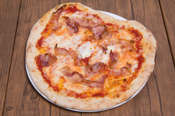 Pizza margherita with parma ham and rocket.