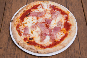 Homemade pizza with ham.