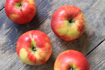 Red apples on wooden table