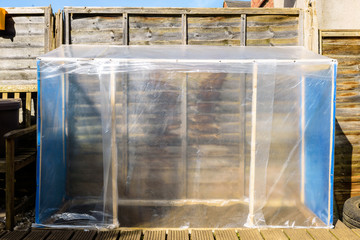 handmade greenhouse in back garden in england uk