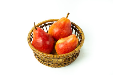 Ripe red yellow Pear fruits in  a basket isolated on white background