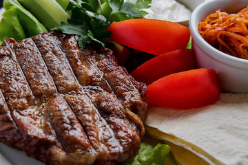 Delicious barbecue meat grilled with vegetables