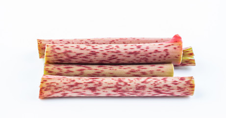 Sour tube rods with fresh wild herbs on white background
