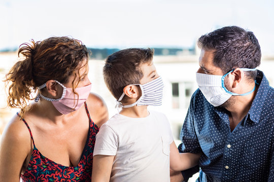 Happy family with protective   masks