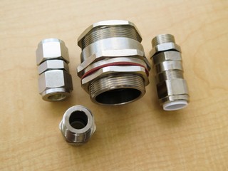 Explosion proof cable gland set isolated on wood background
