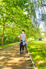 Obraz premium Coronavirus pandemic, walking with a mask respecting social distance in a park