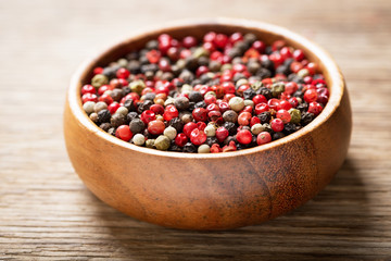 bowl of various peppercorns
