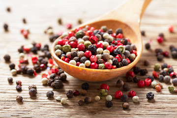  mixed of peppercorns in a spoon