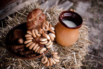 Dinner in the countryside after a hard day's work with bread and milk. Fragrant bread and fresh milk. Dinner at sunset in the countryside. Cozy atmosphere. Sunset. Fresh, organic products..