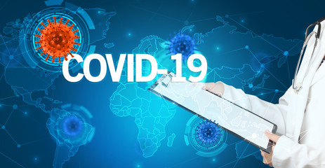 Doctor fills out medical record with COVID-19 inscription, virology concept