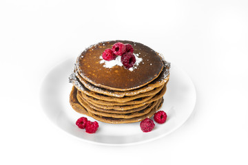 Stack of pancakes on a white plate, isolated on a white background