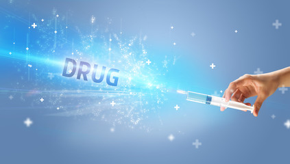 Syringe, medical injection in hand with DRUG inscription, medical antidote concept