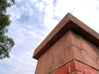 Under view of overpass head concrete pillar on blue sky background in the morning.