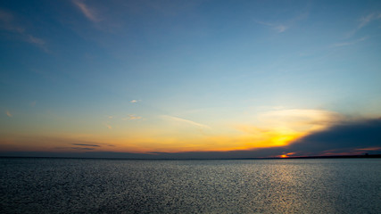 Sunset on the sandy beach, beach, beautiful sky, dramatic sky.