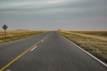 Naklejka premium Country road in Argentina, Buenos Aires province, during a road trip