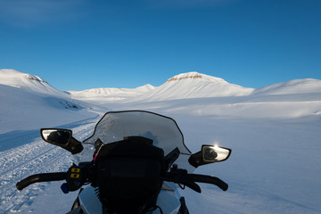 Snowmobile seat with the untouched Arctic landscape that Svalbard offers, Northern Norway. 